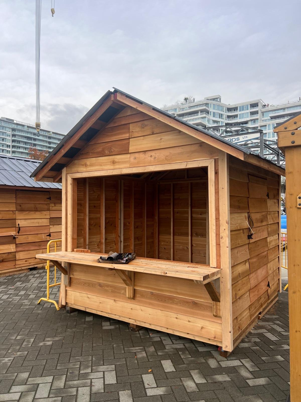 Cedar vendor hut at a seasonal holiday market