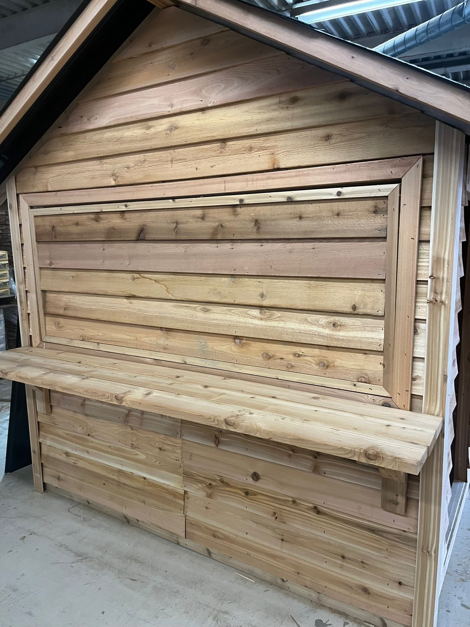 Cedar market stall with service counter