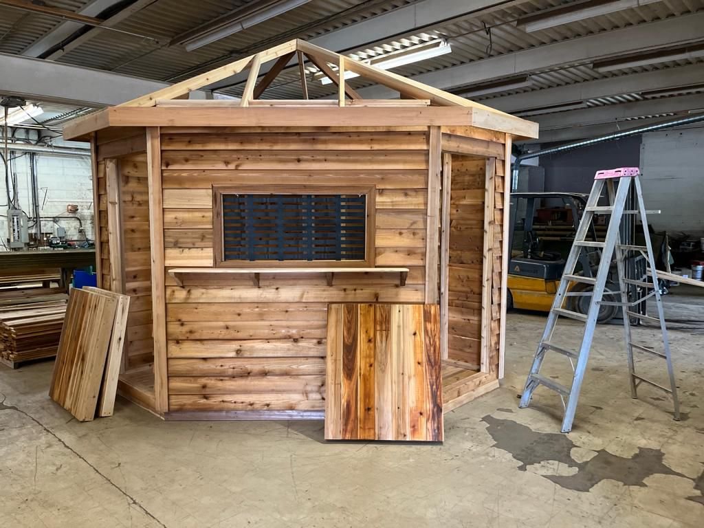 Cedar market stall with serving window in the shop